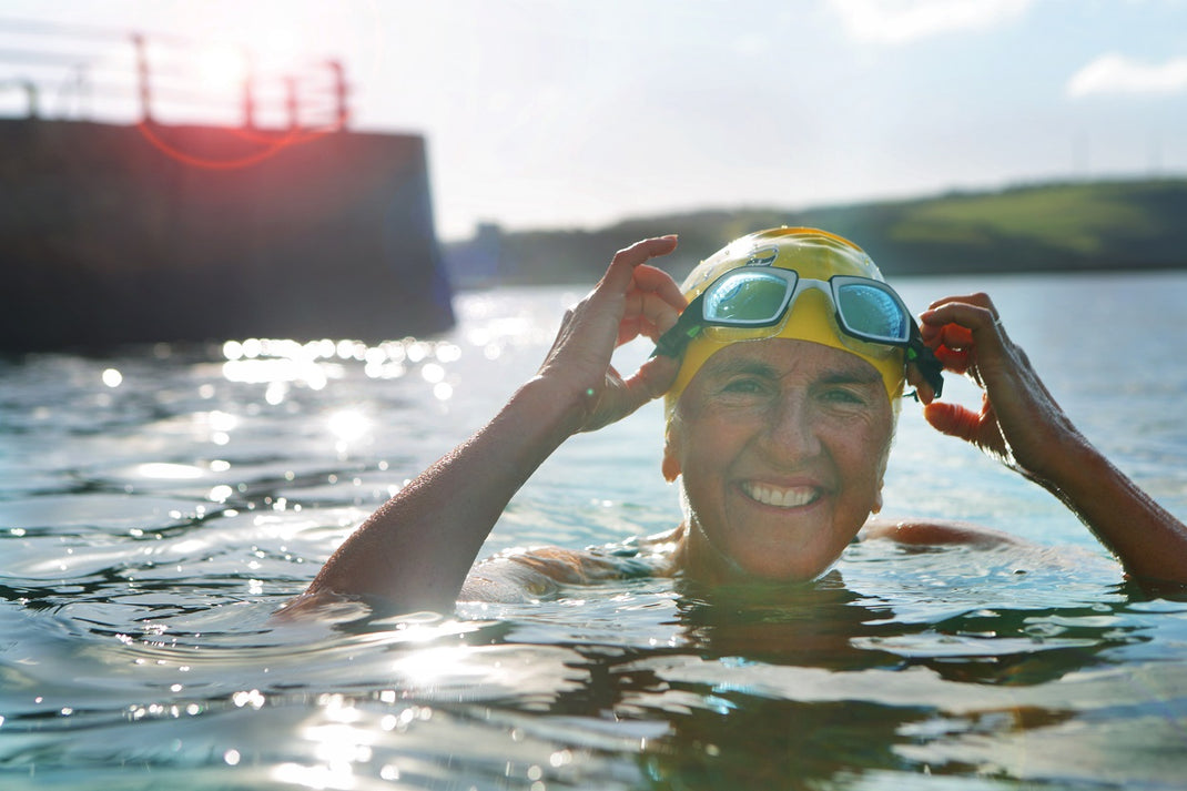 Woman in swimming hat in the sea